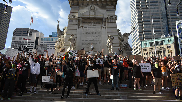 Protesters gathered at Monument Circle Tuesday evening after marching to the City-County Building and the Indiana Statehouse. - Justin Hicks/IPB News