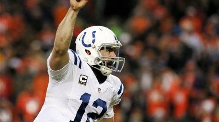 Indianapolis Colts quarterback Andrew Luck celebrates a touchdown pass against the Denver Broncos during the second half of an NFL divisional playoff football game, Sunday, Jan. 11, 2015, in Denver.  - Associated Press photo