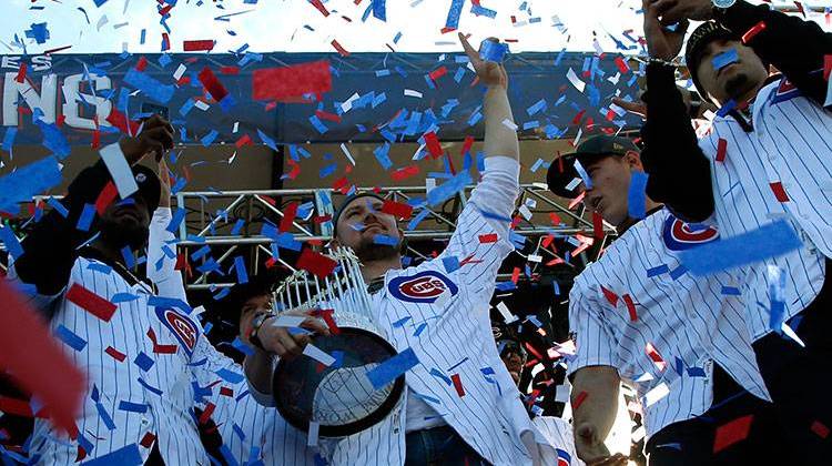 Chicago Cubs' Jon Lester holds the Commissioners Trophy as he celebrates with teammates at Grant Park in Chicago, Friday, Nov. 4, 2016. The trophy is now on a tour across the Midwest.  - AP Photo/Nam Y. Huh