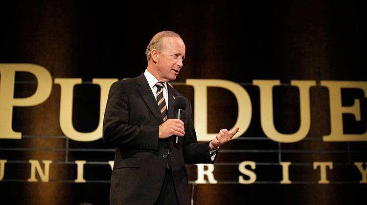 Mitch Daniels answers question during a news conference after being named president of Purdue University in 2012. - AP Photo/Michael Conroy