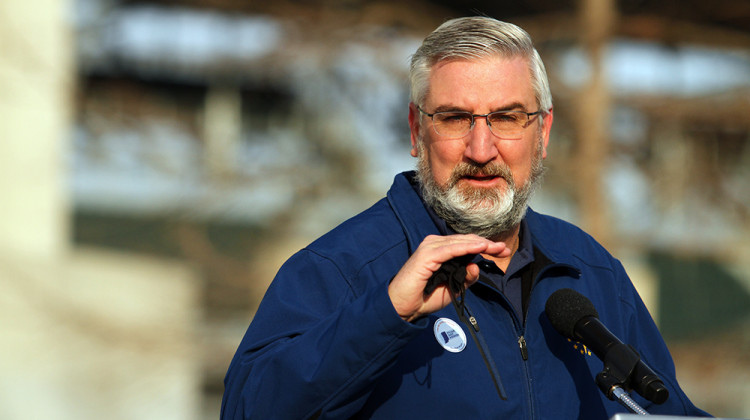 Gov. Eric Holcomb, shown here speaking during a press conference in March, is asking a court to block a new law passed by state legislators giving themselves more authority to intervene when the state’s chief executive declares an emergency. - Doug Jaggers/WFYI
