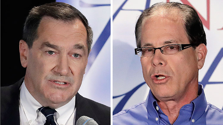 FILE - This combination of Oct. 8, 2018, file photos show Indiana U.S. Senate candidates, Democratic Sen. Joe Donnelly, left, and former Republican state Rep. Mike Braun during a debate in Westville, Ind.  - AP Photo/Darron Cummings, File