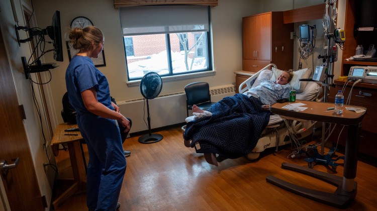 Dr. Emily Hill checks on her patient Karinne Tudor, who is in labor with her second child at Iowa Specialty Hospital in Clarion, Iowa. - Natalie Krebs / Side Effects Public Media