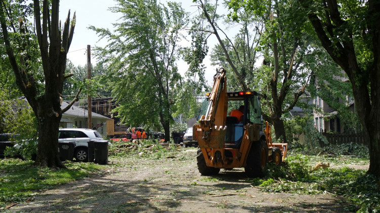 Workers clean up debris left in the wake of the tornado that hit Pendleton Monday. - Micah Yason/WFYI