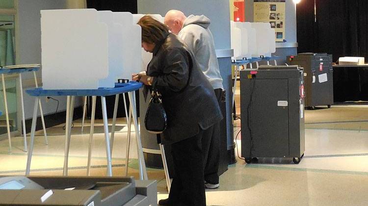 Voters fill out their ballots at the Children's Museum of Indianapolis Tuesday morning. - Becky Harris