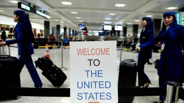 A sign at Washington Dulles International Airport welcomes travelers. A three-judge panel decided not to reinstate President Trump's travel ban barring travelers from seven majority-Muslim nations. - Brendan Smialowski/AFP/Getty Images