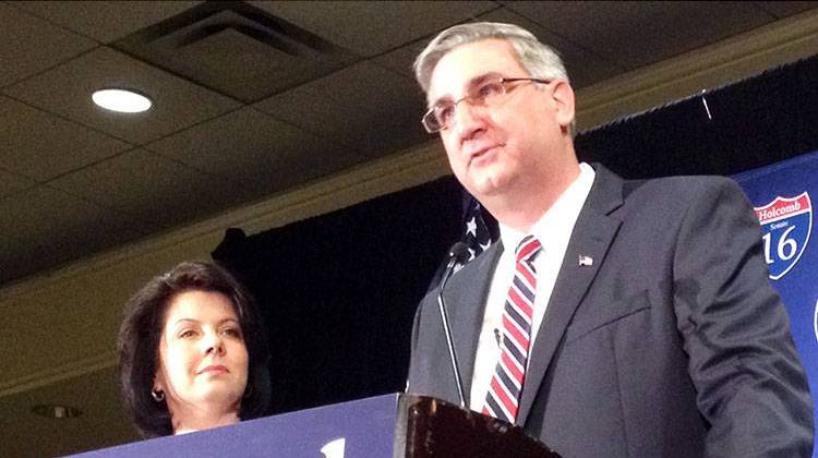 Eric Holcomb announces his candidacy for the U.S. Senate as his wife, Janet, looks on.  - Brandon Smith
