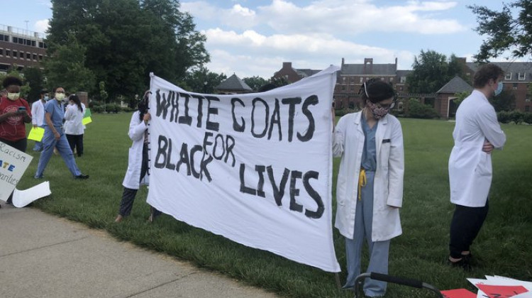 Physicians and medical professionals gathered Wednesday to protest health disparities and racism in medicine. - Carter Barrett/Side Effects Public Media