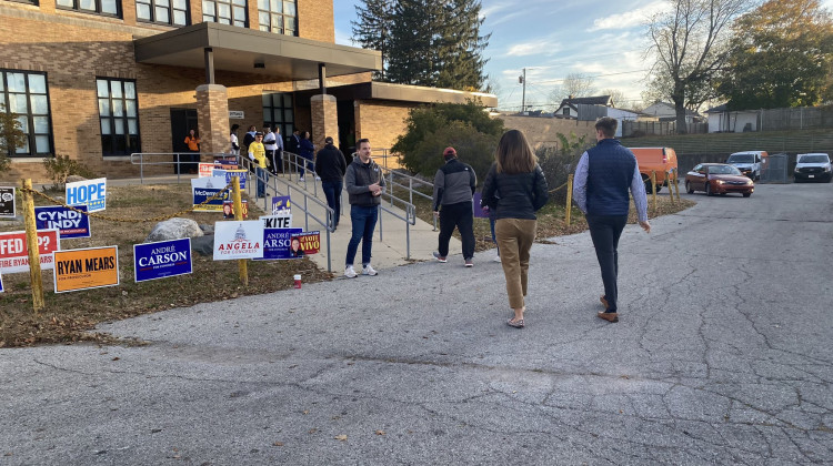 Voters walk into the Broad Ripple High School building on Tuesday morning. - Elizabeth Gabriel/WFYI