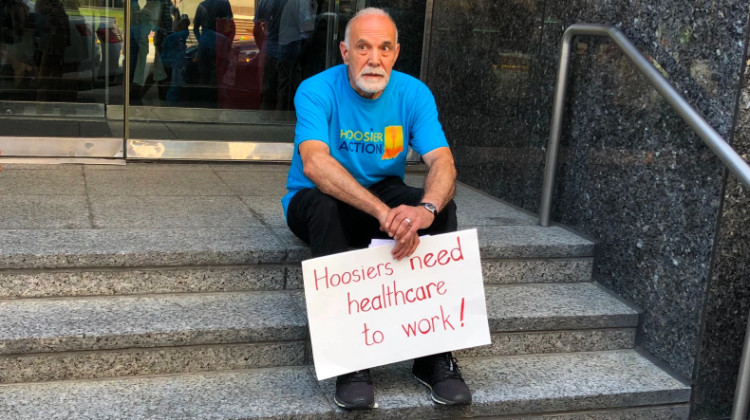 On July 1, 2019, protesters gathered in downtown Indianapolis to protest Gateway to Work, a state program that requires Medicaid recipients to work or volunteer. Protesters delivered thousands of letters to Gov. Eric Holcomb asking him to halt the program's rollout. - Carter Barrett/Side Effects Public Media