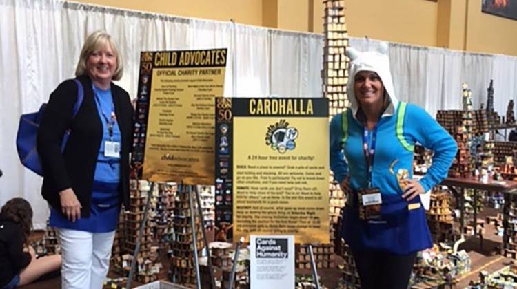 Child Advocates's Cindy Booth and Hannah Gentry stand in front of the Gen Con Cardhalla. - Jill Sheridan/IPB News