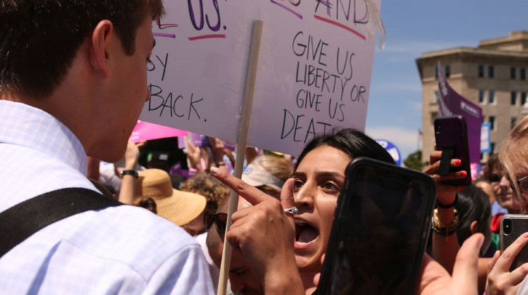 A pro-abortion rights supporter argues with an anti-abortion rights protester in front of the U.S. Supreme Court May 21 during demonstrations in defense of abortion rights. - Anna Gassot/AFP/Getty Images