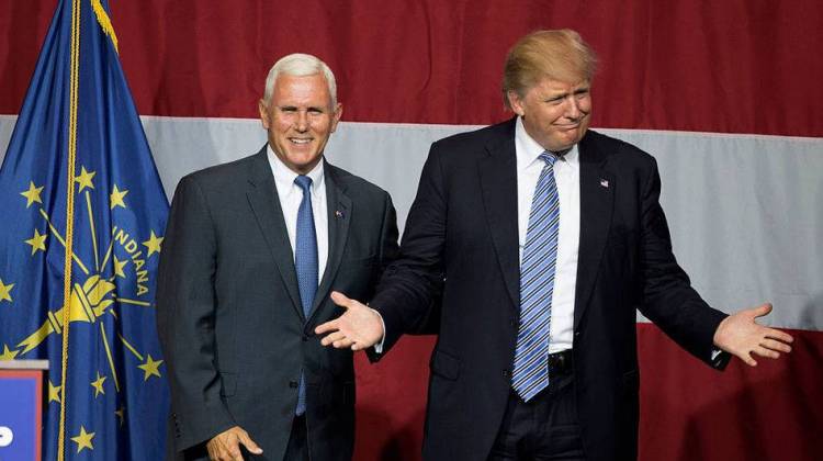 Presumptive Republican presidential candidate Donald Trump (right) and Indiana Gov. Mike Pence take the stage during a campaign rally at Grant Park Event Center in Westfield, Ind.