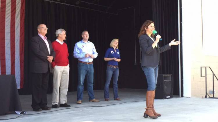 Christina Hale speaks to a crowd in Bedford while, behind her from left to right, Gregg, former U.S. Rep. Baron Hill, Democratic Party chair John Zody and 9th Congressional District Democratic candidate Shelli Yoder look on. - Brandon Smith/IPBS