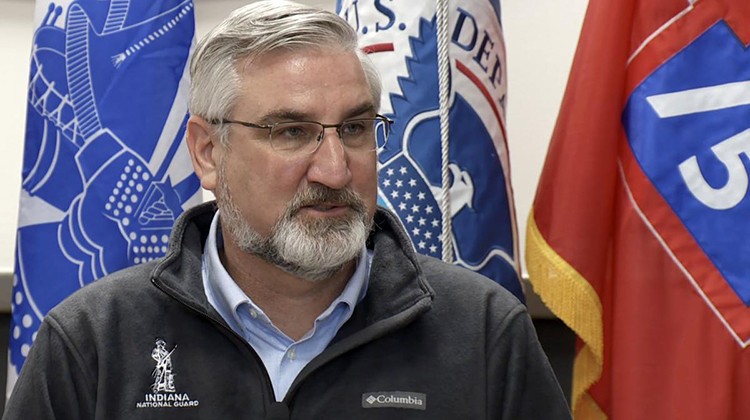 Gov. Eric Holcomb speaks during a Tuesday news conference at Camp Atterbury.  - Devan Ridgway/ WTIU-WFIU News