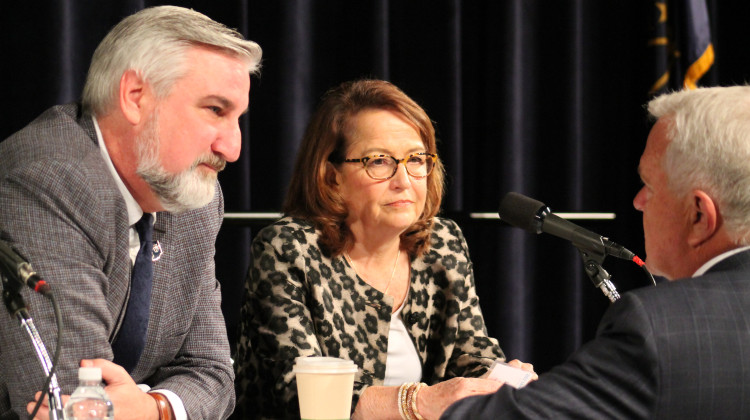 Gov. Eric Holcomb, left, and Chief Justice Loretta Rush, center, speak with Rep. Greg Steuerwald (R-Avon), right, before the start of the 2022 Indiana Mental Health Summit. - Brandon Smith/IPB News