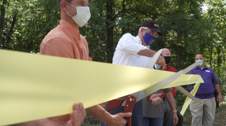 Gov. Eric Holcomb at a ribbon cutting for Ravinia State Forest last year. Tim Maloney with the Hoosier Environmental Council said the pandemic has shown the state needs more natural spaces for the public. - Alan Mbathi/IPB News