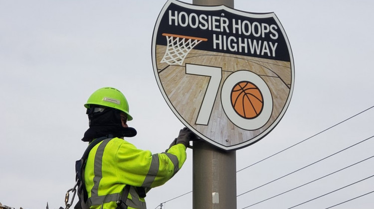 An Indiana Department of Transportation worker installs one of the special signs along Interstate 70. - Courtesy of the Indiana Department of Transportation via Twitter