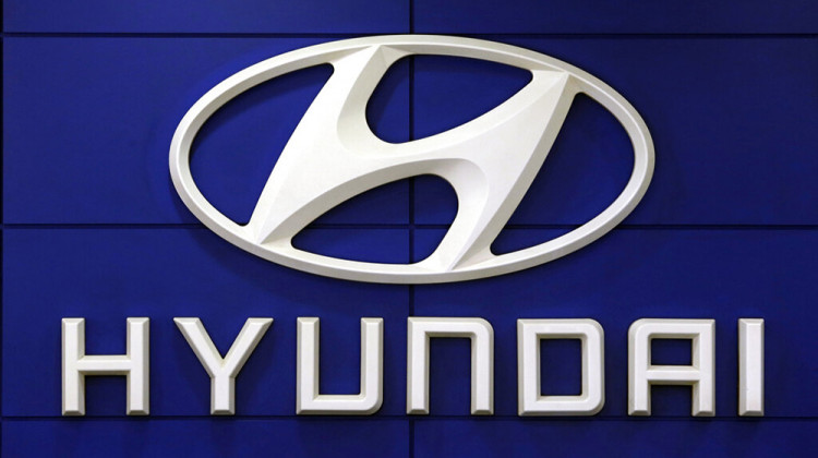 FILE - This July 26 2018 file photo shows the logo of Hyundai Motor Co. in Seoul, South Korea. Hyundai is recalling over 390,000 vehicles in the U.S. and Canada, Tuesday, May 4, 2021, for problems that can cause engine fires. In one recall, owners are being told to park outdoors until repairs are made. That recall covers more than 203,000 Santa Fe Sport SUVs from 2013 through 2015. - AP Photo/Ahn Young-joon, File