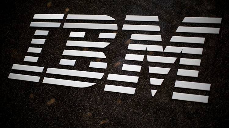 FILE - In this April 26, 2017, file photo, the IBM logo is displayed on the IBM building in Midtown Manhattan, in New York. In a judge's ruling dated Friday, Aug. 4, 2017, IBM Corp. owes the state of Indiana $78 million in damages stemming from the company's failed effort to automate much of Indiana's welfare services. Indiana and IBM sued each other in 2010 after then-Gov. Mitch Daniels canceled the company's $1.3 billion contract. - AP Photo/Mary Altaffer, File
