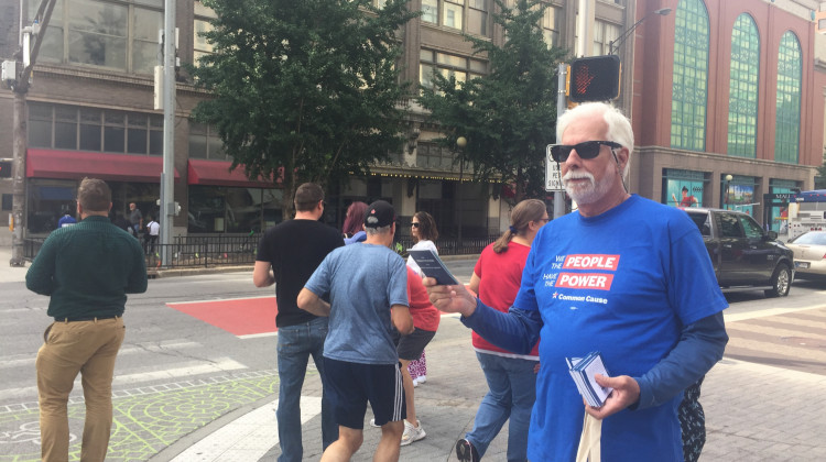 Volunteers handed out 1,000 pocket-sized editions of the U.S. Constitution to passersby in downtown Indianapolis Tuesday. - Erica Irish/WFYI