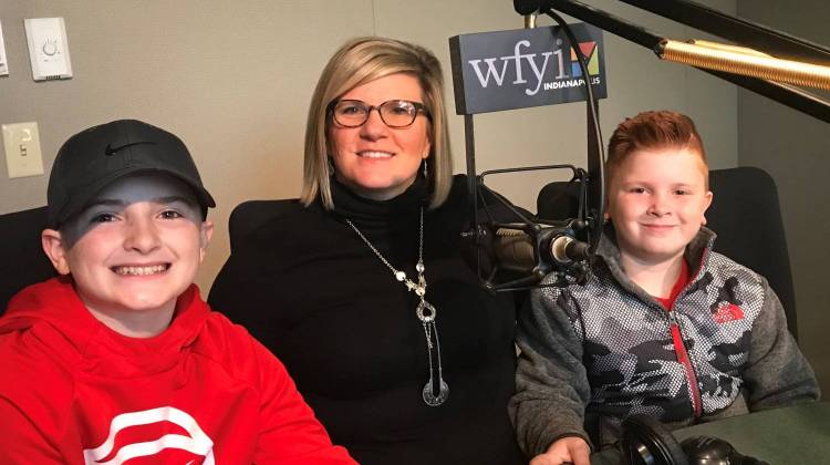 Emily Perry, executive director of Susieâ€™s Place, with her sons Ian (left) and Alec (right) in the WFYI studio. Perry has been named Youth Worker of the Year by the Indiana Youth Institute. - Taylor Bennett/WFYI