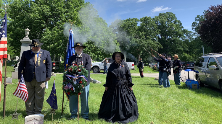 Members of the 27th Indiana Volunteer Infantry give a rifle salute on Monday, May 27, 2019 at Crown Hill Cemetery in honor of Civil War veteran Capt. Richard Burns. - Micah Yason/WFYI