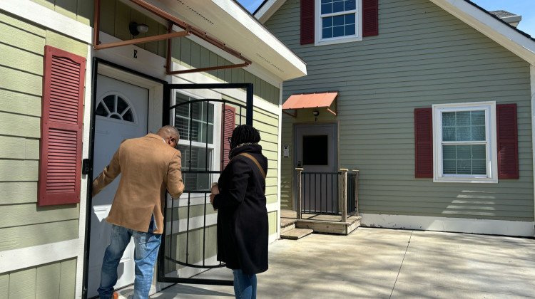 Damon Mills and Kia Wright open the door to one of the units at Jake’s Place on March 19, 2024. The transitional housing complex is for young adults ages 18-22 in Marion County. - Abriana Herron / WFYI