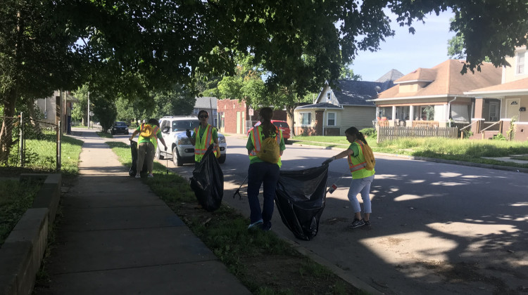 Volunteers pick up trash near Brookside Community Church on the city's Near Eastside. - Emily Cox/WFYI News