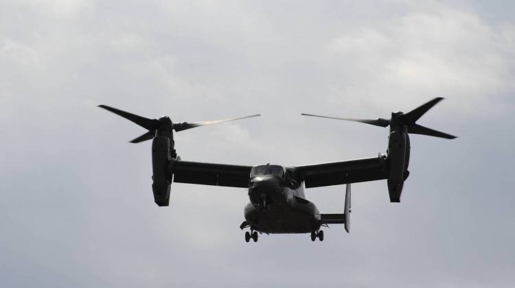 A V-22 "Osprey" helicopter (with Rolls-Royce engines) flies over the dedication ceremony. - Stan Jastrzebski / Indiana Public Broadcasting