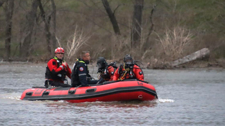 In this March 30 photo divers from the Indianapolis Fire Department search the White River for a 17-year-old boy who went missing when a canoe he had been riding in went over a dam. - Provided by the Indianapolis Fire Department