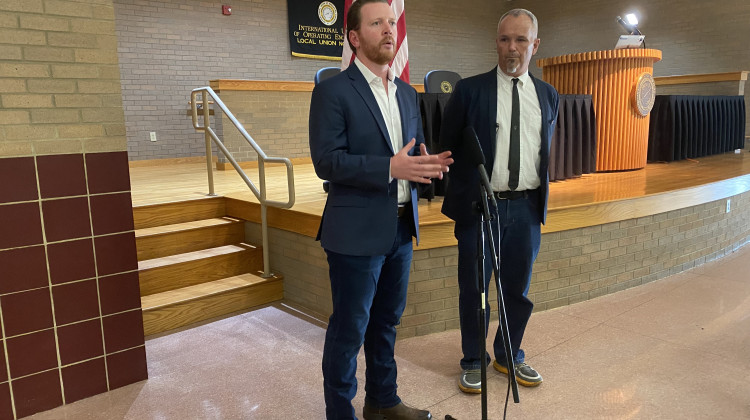 Indiana Democratic Party Chair Mike Schmuhl (left) and 2nd Congressional District candidate Paul Steury speak after the Democratic caucus to fill a special election ballot vacancy on Tuesday, Aug. 23. - Gemma DiCarlo / WVPE News