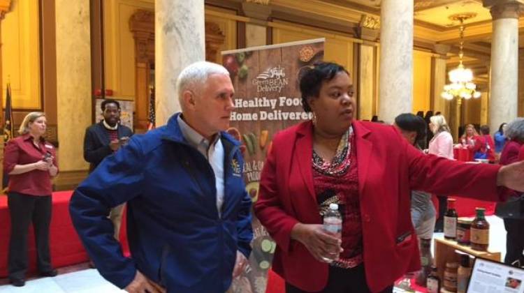 Governor Pence and Danielle Patterson check out the AHA spread at the Statehouse.
