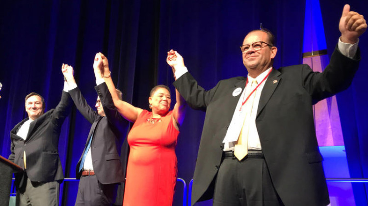A state party convention staple that will be missing this year: in 2018, Indiana Democrats' statewide candidates joined hands on stage as the convention wrapped up.  - FILE PHOTO: Brandon Smith/IPB News