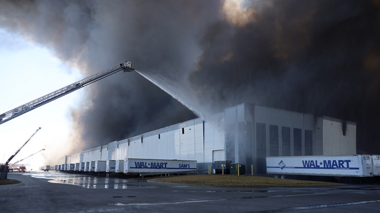 Firefighters fought the Walmart warehouse fire from outside the building Wednesday. Crews were still at the scene Thursday dousing hotspots in the rubble. - Provided by Indianapolis Fire Department
