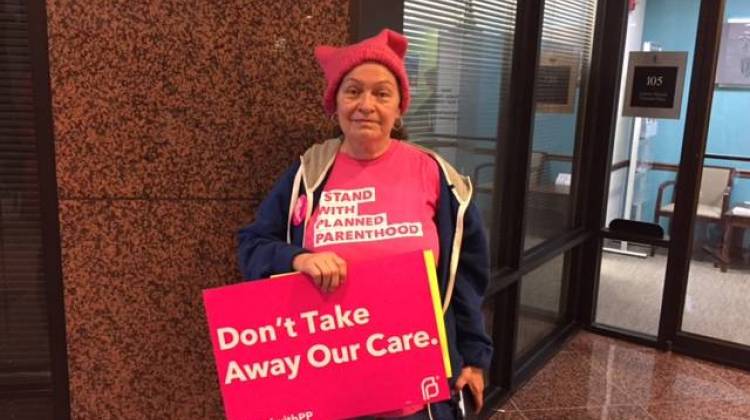 A Planned Parenthood supporter poses with her sign after the U.S. House of Representatives passed the American Health Care Act on Thursday. - Jill Sheridan/IPB