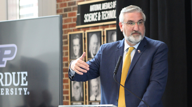 Governor Holcomb speaks during Wednesday's announcement about a new semiconductor production facility in West Lafayette. - Ben Thorp/WBAA News