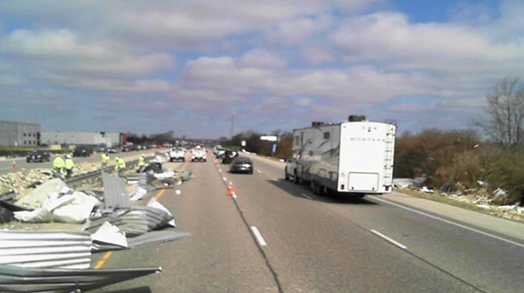 INDOT crews worked Sunday to clean up debris on Interstate 65 near Whiteland in Johnson County. - Indiana Department of Transportation