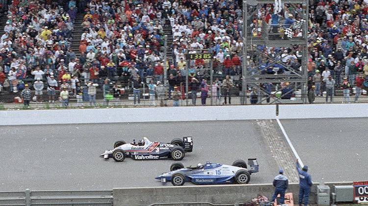 In this May 24, 1992 file photo, Al Unser Jr. (top) wins the Indianapolis 500 auto race by less than a car length ahead of Scott Goodyear in the 76th running of the race at Indianapolis Motor Speedway. - AP Photo/David Boe