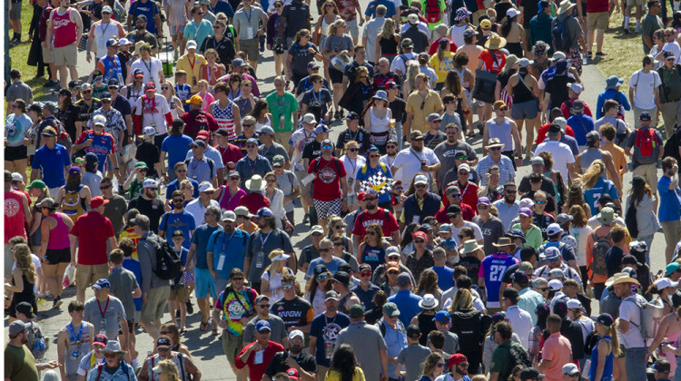 Fans make their way through the infield of the Indianapolis Motor Speedway before the start of the 106th Indianapolis 500 on Sunday, May 29. The race was nearly sold out. Pandemic restrictions kept fans away in 2020 and limited capacity in 2021. This year's race attendance topped 300,000 people.  - Doug Jaggers/WFYI