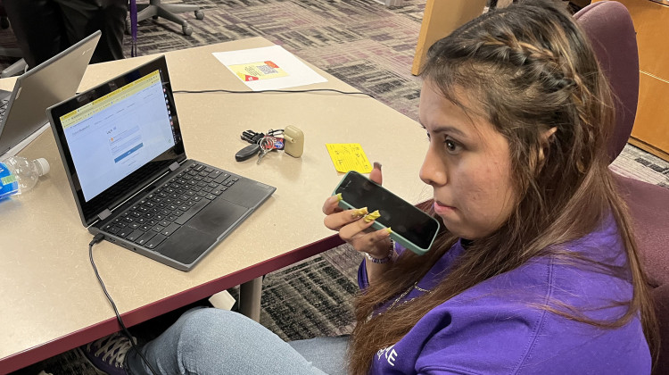 Ben Davis High School senior Isela waits on hold with the federal financial aid hotline Thursday, April 4, 2024 at the school. She needed help completing the new version of the Free Application for Federal Student Aid. - Lee V. Gaines / WFYI