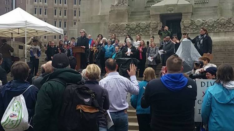 ACLU executive director Jane Henegar leads a crowd of more than 100 in the People's Oath, the same President Donald Trump took on Friday. - Lauren Chapman/IPB News