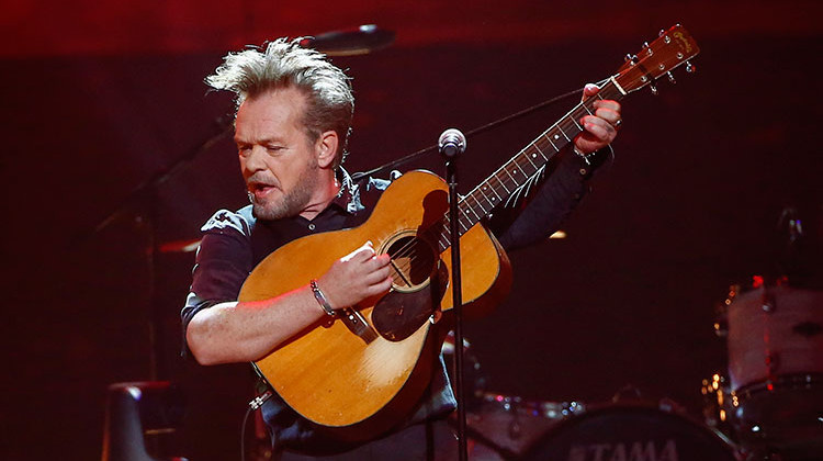 FILE - In this Thursday, April 6, 2017, file photo, John Mellencamp performs at a concert at Bridgestone Arena in Nashville, Tenn. Mellencamp will be presented with the Woodie Guthrie Prize in August. - Photo by Al Wagner/Invision/AP, File