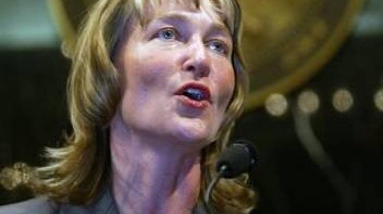 In this Oct. 20, 2003 file photo, Kathy Davis addresses the Indiana House after her nomination as Indiana's lieutenant governor was approved in an unanimous voice vote by the House at the Statehouse in Indianapolis. U.S. Sen. Joe Donnelly lost his campaign treasurer Wednesday, Aug. 5, 2015 after he was one of two Democrats to vote with Republicans in an unsuccessful effort to strip Planned Parenthood of federal funding. - The Associated Press