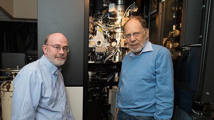 Michael Rossmann (right), Purdue Universityâ€™s Hanley Distinguished Professor of Biological Sciences, and Richard Kuhn, director of the Purdue Institute for Inflammation, Immunology and Infectious Diseases, stand with the cryo-electron microscope used to determine the structure of the Zika virus.  - Purdue University photo/Mark Simons