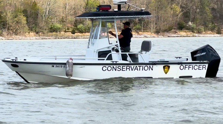 A conservation officer participates in the search for a pair of missing IU students at Lake Monroe Saturday.  - Liz DeSantis / WTIU