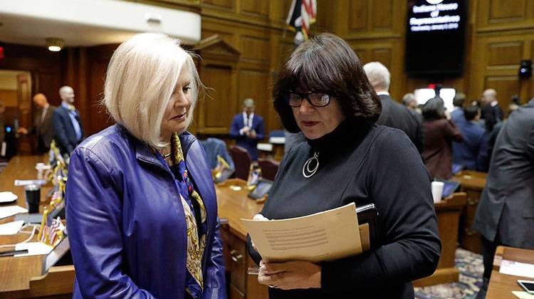 State Rep. Linda Lawson, right, D-Hammond, talks with state Rep. Terri Austin (D-Anderson) following the opening day of the General Assembly session at the Statehouse, Wednesday, Jan. 3, 2018, in Indianapolis. - AP Photo/Darron Cummings