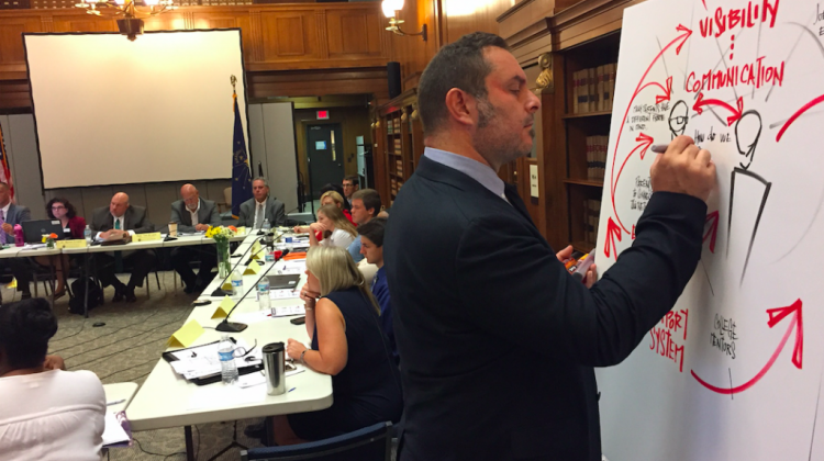 Mike Fleisch illustrates and takes notes on the discussion by the Graduation Pathways Committee members Aug. 23, 2017 at the Indiana State Library in Indianapolis. - Eric Weddle/WFYI