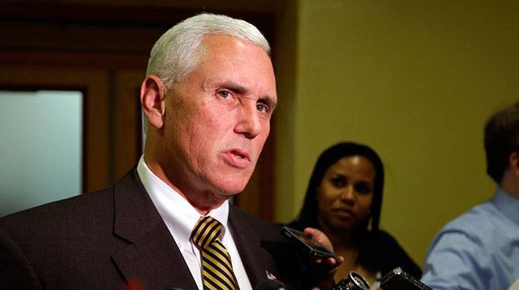 Gov. Mike Pence, shown here responding to a questions from reporters at the Statehouse on Sept. 9, says Indiana should advance pre-K education "without federal intrusion." - AP Photo/Michael Conroy