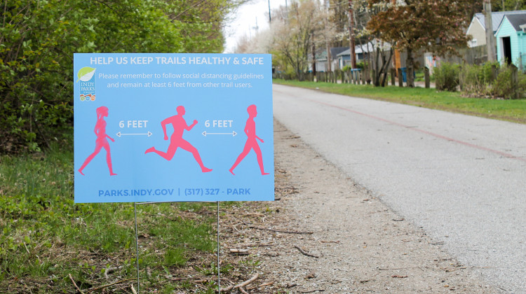 Along Indianapolis's Monon Trail, signs offer guidance on how to maintain social distancing from other trail users. -  Lauren Chapman/IPB News
